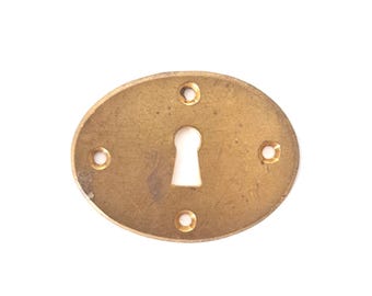 Vintage brass oval escutcheon.