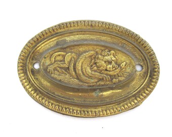 Antique stamped, pressed brass escutcheon, lion, furniture applique. #908G28K21