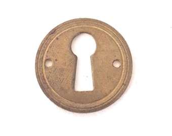 Small round stamped keyhole cover, escutcheon, key hole frame, plate.