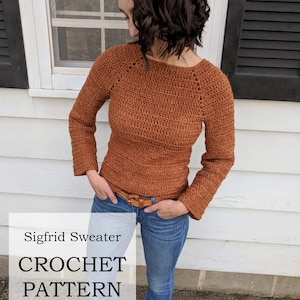 May include: A brown crochet sweater with long sleeves and a scoop neck. The sweater is called the Sigfrid Sweater Crochet Pattern by Lady Jay Crochet.