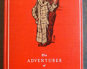May include: A vintage book cover with a red background and white border. The title "The Adventures of M. D'Haricot" is in white text. An illustration of a man in a checkered coat and hat is featured on the cover.