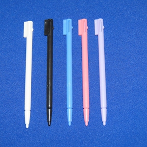 May include: Six different colored stylus pens for a touch screen device. The pens are white, black, light blue, pink, and purple.