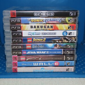 May include: A stack of ten video game cases for the Playstation 3 console. The games include Sonic & Sega All-Stars Racing, Bakugan Battle Brawlers, MySims Sky Heroes, Lego Batman 2 DC Super Heroes, Lego Harry Potter, Lego Star Wars III The Clone Wars, Lego Indiana Jones 2 The Adventure Continues, Wall-E, and LittleBigPlanet.