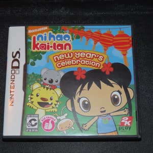 May include: A Nintendo DS game case featuring the Nickelodeon show "Ni hao, Kai-lan" with the title "New Year's Celebration". The cover art features Kai-lan, a young Chinese-American girl, with her friends Rintoo the tiger, Hoho the monkey, and To-To the koala.
