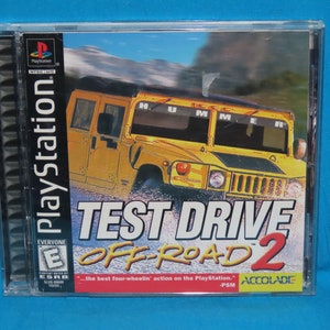 May include: A PlayStation game case for Test Drive Off-Road 2. The case is black with a yellow Hummer on the front. The game is rated E for Everyone by the ESRB. The text on the case reads "...the best four-wheelin' action on the PlayStation." -PSM ACOLADE