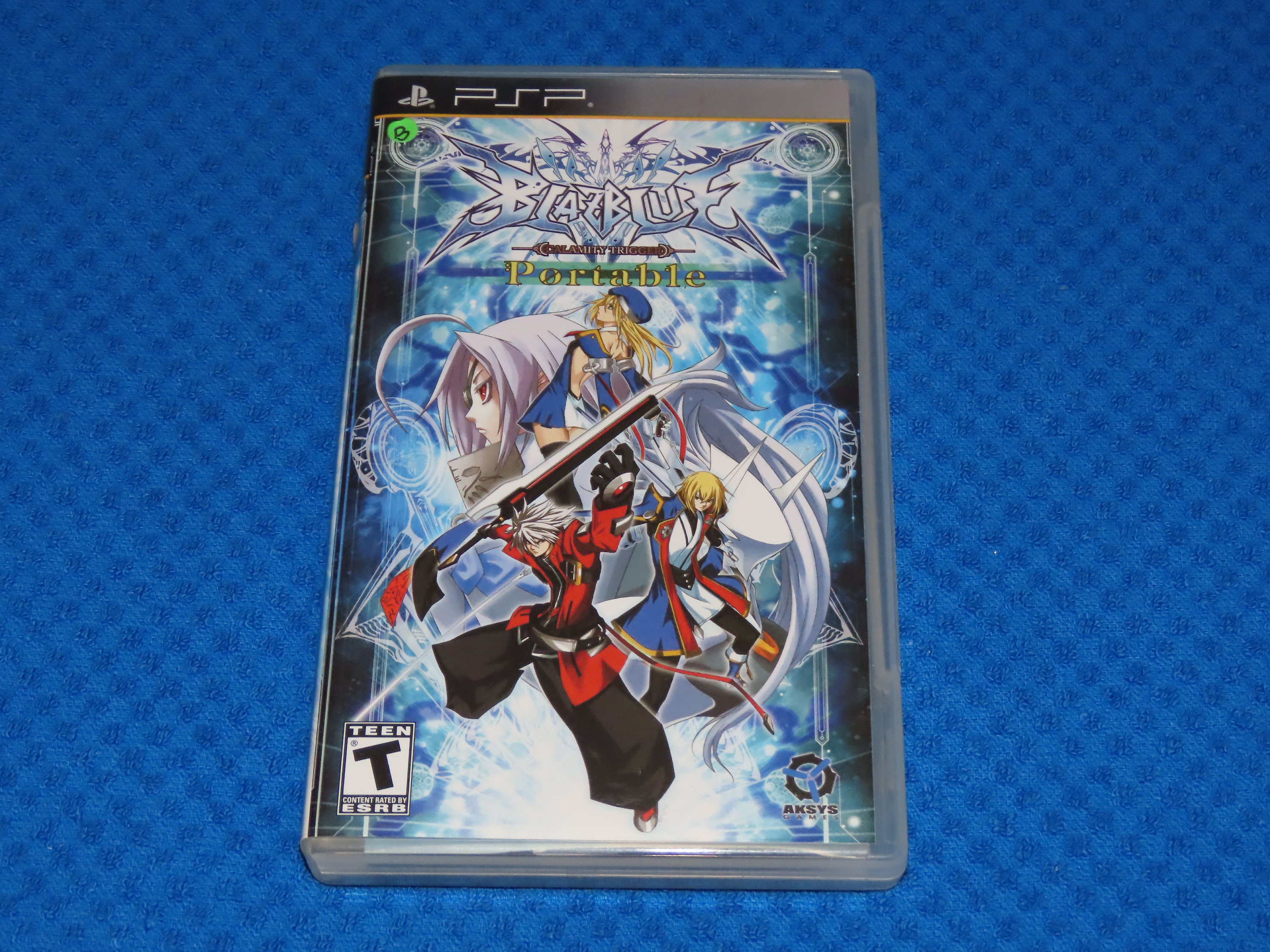 Jeu PSP BlazBlue: Calamity Trigger - Version Complète, Très Bon état