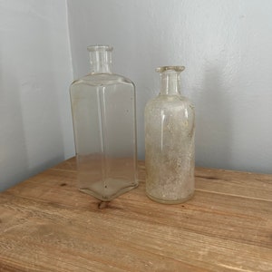 Set of 2 vintage barn find bottles