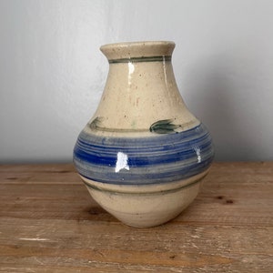 Handcrafted pottery vase with blue and green decoration