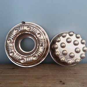 Set of 2 vintage copper toned decorative molds