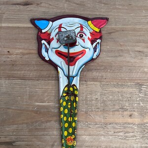 Vintage devil clown metal noisemaker