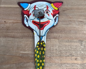 Vintage devil clown metal noisemaker