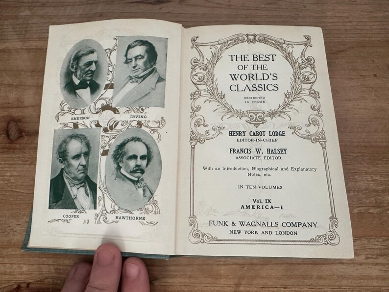 May include: Open book with pages featuring portraits of Emerson, Irving, Cooper, and Hawthorne. The right page displays the title "The Best of the World's Classics" and the names of the editors. Published by Funk & Wagnalls Company.