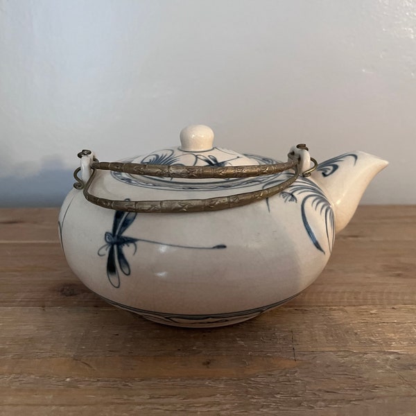 Dragonfly teapot with embossed metal handles