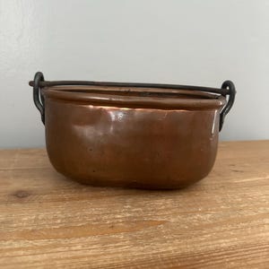 Antique primitive oval copper pot with iron handle