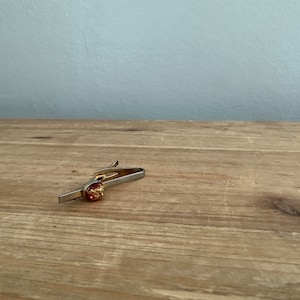 Vintage Hickok red lucite with gold flake tie clip