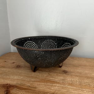 Vintage enamel black speckled footed colander