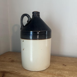 Antique brown and white whiskey jug
