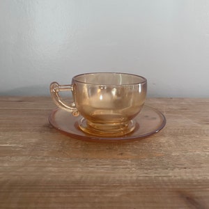 Marigold lustre glass teacup and saucer