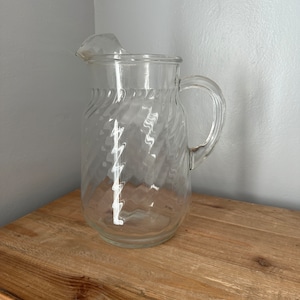 Vintage glass pitcher with ice lip