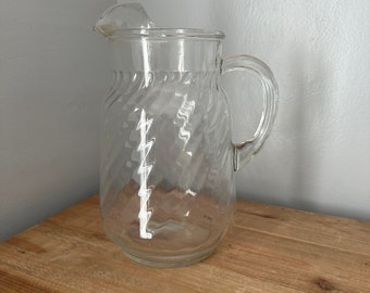 Vintage glass pitcher with ice lip