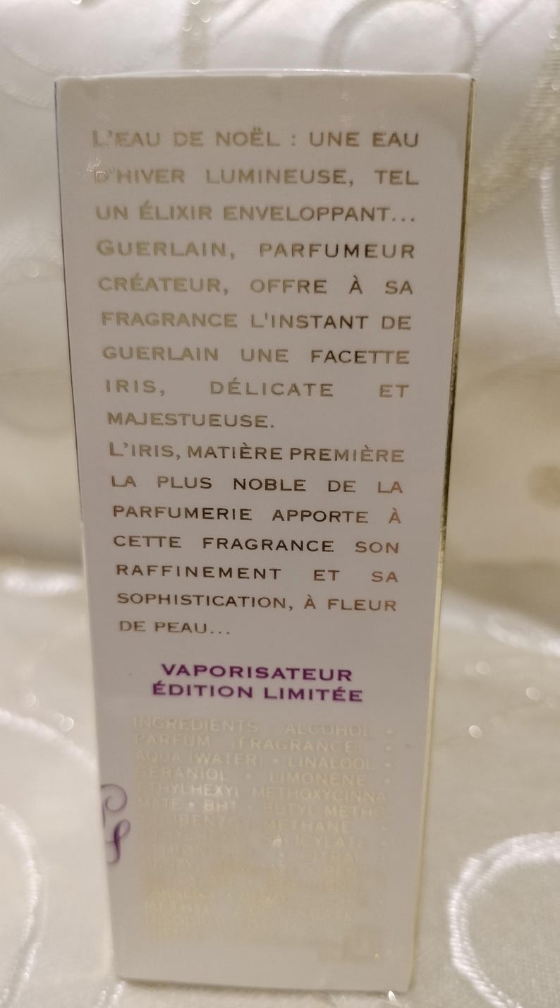 May include: A white perfume box with French text. The text describes a winter fragrance with iris notes, a creation of Guerlain. The box reads "Vaporisateur &Eacute;dition Limit&eacute;e".