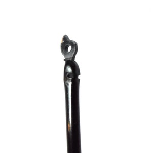 May include: Close-up of a black metal hook with a small loop at the top.