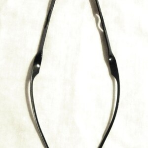 May include: Two black metal wire frames for glasses.