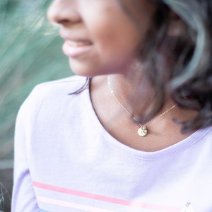 Double digits birthday gift — custom necklace with initial and birthstone for daughter’s 10th birthday.