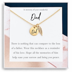 May include: A gold-toned necklace featuring a circular pendant engraved with the word Dad and a small angel wing charm. The necklace is displayed on a white card with the text In memory of your wonderful Dad and a message about loss.