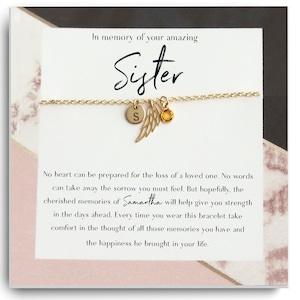 May include: A gold charm bracelet with a small angel wing charm and a letter 'S' charm. The bracelet comes with a card that reads "In memory of your amazing Sister. No heart can be prepared for the loss of a loved one. No words can take away the sorrow you must feel. But hopefully, the cherished memories of Samantha will help give you strength in the days ahead. Every time you wear this bracelet take comfort in the thought of all those memories you have and the happiness he brought in your life."
