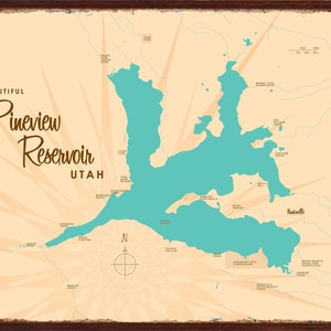May include: A vintage-style metal sign featuring a map of Pineview Reservoir in Utah. The map is in teal against a tan background with a compass rose and the words "Beautiful Pineview Reservoir Utah" in a decorative font. The sign has a dark brown border.