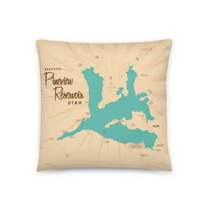 May include: Square throw pillow featuring a map of Pineview Reservoir in Utah. The map is in shades of teal and brown, with the words "Beautiful Pineview Reservoir Utah" printed on the pillow. The pillow has a cream-colored background.