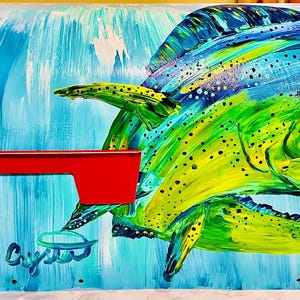May include: A hand-painted mailbox featuring a vibrant mahi-mahi fish design. The fish is depicted in shades of green, yellow, and blue against a backdrop of blue water. A red metal flag is attached to the side. The word "Crysta" is written on the bottom.