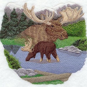 May include: An embroidered design of a brown moose and a calf standing in a blue stream. The moose has large antlers and the calf is smaller with a shorter neck. The background is a green forest with a snowy mountain range in the distance.