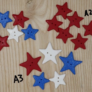May include: A collection of red, white, and blue star-shaped buttons. The buttons are arranged in three groups labeled A1, A2, and A3.