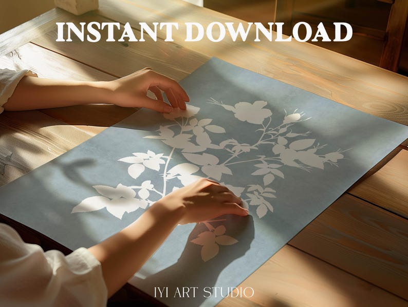 May include: A rectangular print featuring a white botanical illustration of flowers and leaves on a muted blue background. The text INSTANT DOWNLOAD is printed in white at the top, and the text IYI ART STUDIO is printed in white at the bottom.