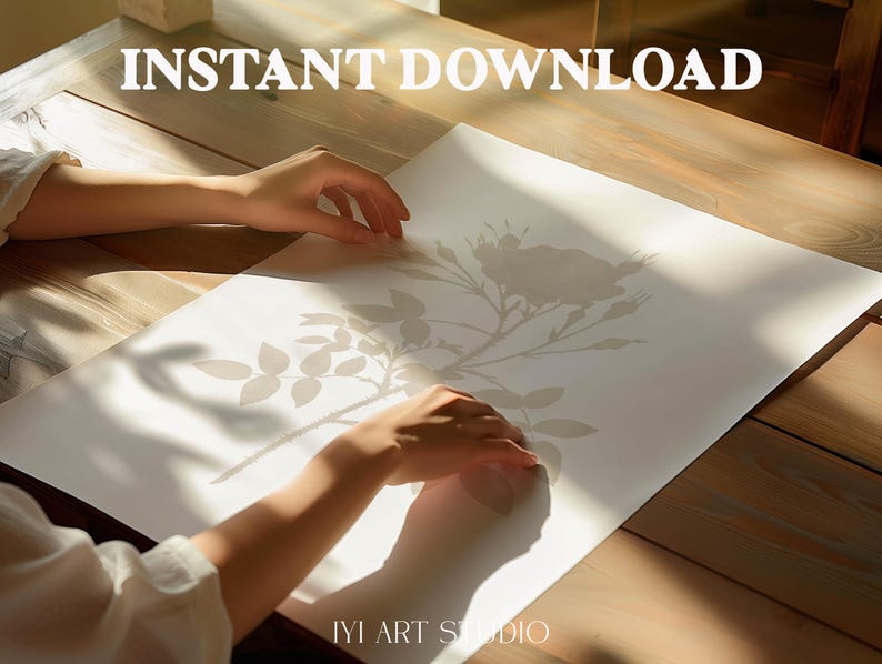 May include: A white rectangular paper print featuring a light gray botanical illustration of a rose with leaves and thorns. The text INSTANT DOWNLOAD is printed in white at the top, and the text IYI ART STUDIO is printed in white at the bottom.