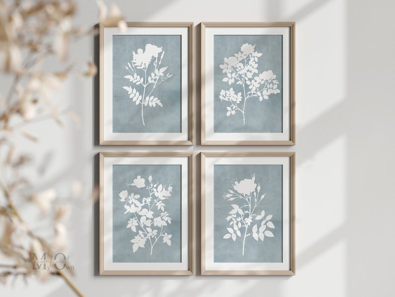 Set of 6 watercolor botanical wall art illustrations with a white flower against a light blue background.