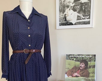 Western style fit and flare dress with collar and pleated skirt. Navy blue. Estimated size medium/large