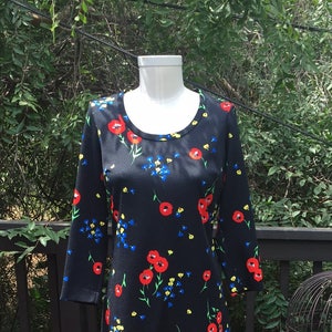 1960&#39;s Black Flower Print Mod Dress. Crew Neck. Midi Length. Long Sleeve. Sized: Small/Medium