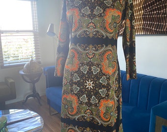 1970s Black and Orange Scarf Print Dress. Center Back Zipper, Cowl Neck. Fabric Provides Some Stretch. Size medium/ large