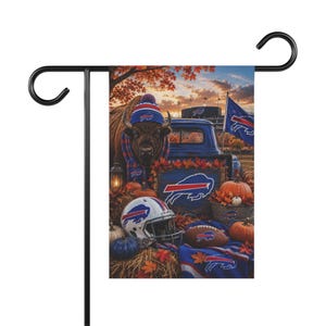 May include: A rectangular garden flag featuring a Buffalo Bills theme with a bison wearing a beanie and scarf, a blue truck, a football helmet, a football, pumpkins, and autumn leaves. The Buffalo Bills logo is displayed on the truck, helmet, and flag.