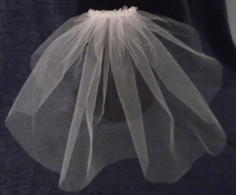 Single Tier Shoulder Length Crystal Cut Edge Bridal Veil Available in white or ivory.