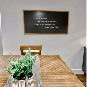 Dearly Beloved We Are Gathered Here Today To Get Through This Thing We Call Life Framed Wood Sign