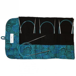 May include: A teal blue fabric roll-up case with a floral pattern and the text "HiyaHiya" on the side. The case contains a set of eight circular knitting needles.