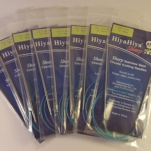 May include: A set of eight HiyaHiya Sharp circular knitting needles in various sizes. The needles are made of stainless steel and have a blue and white packaging with a panda bear logo. The packaging includes the text "HiyaHiya Sharp" and "Sharp Stainless Steel Circular Knitting Needles".