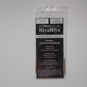 May include: A close-up of a package containing a pair of bamboo circular knitting needles. The package is labeled "HiyaHiya" and features the text "Bamboo Circular Knitting Needle".