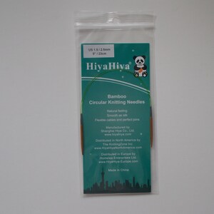 May include: A green and brown HiyaHiya Bamboo Circular Knitting Needle set in a clear plastic bag. The needles are 8 inches (23 cm) long and are size US 1.5/2.5mm.