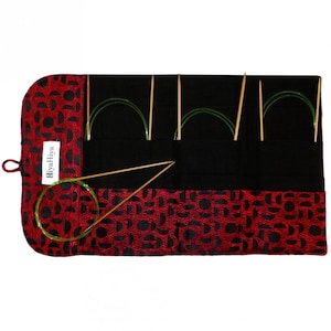 May include: A red and black fabric roll with a label that says "HiyaHiya" and contains multiple sets of knitting needles.