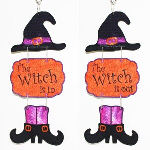 May include: Two Halloween decorations, each with a witch's hat, a sign that says "The Witch is in" or "The Witch is out", and a pair of witch's boots.